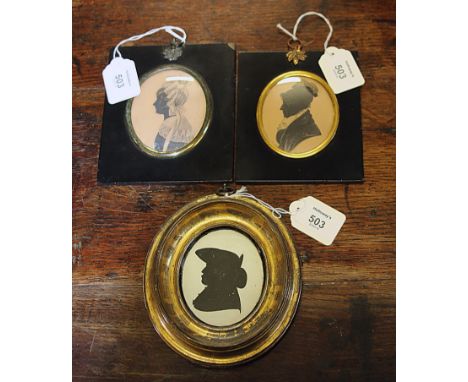 An early 19th century oval silhouette portrait miniature, annotated on later card backing 'Drawn by John Major London March 1