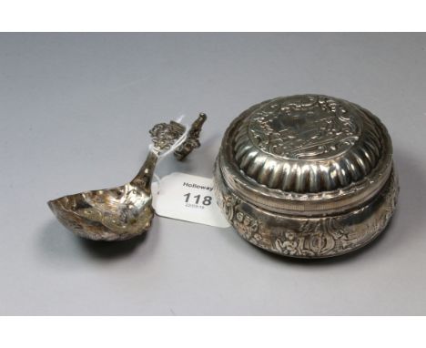 A late Victorian Dutch silver trinket box, circular, profusely chased with rural landscapes to hinged cover and sides, Englis