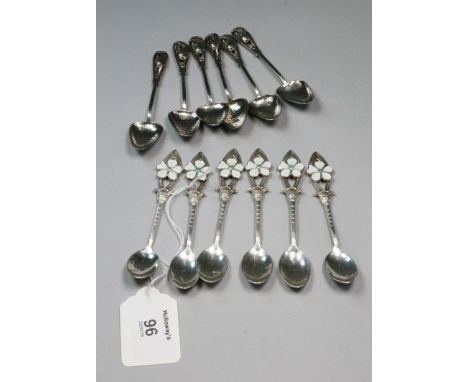 A set of six early 20th century sterling silver Arts and Crafts demi-tasse coffee spoon, with pierced and spot-hammered decor