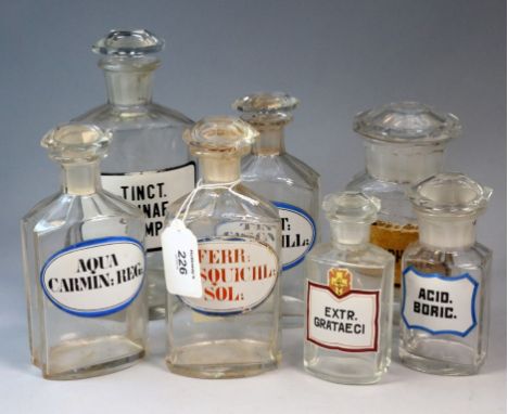 Severn late 19th century/early 20th century glass chemists' jars, each named, one with paper label the others enamel, various