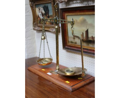A Co-operative Wholesale Society Limited  mahogany and gilt brass beam scales and weights, with trade plaque