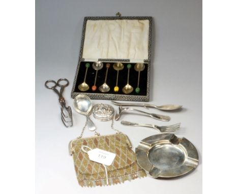 A George III fiddle pattern caddy spoon, London 1816 by William Eley and William Fearn, a silver preserve spoon, a silver ash