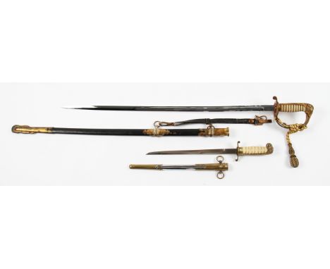 A reproduction naval dress sword with brass hilt having elephant head design with faux shark skin handle, with brass and leat