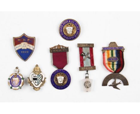 A group of Masonic and Benevolent fund badges to include four silver gilt and enamel examples, hallmarked between 1934 and 19