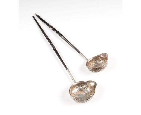 A George III silver ladle, the bowl having inset James I 1605 sixpence, the surround being of repousse garland design with bl