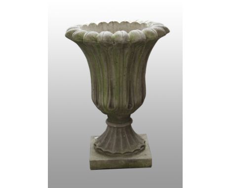 A pair of concrete garden urns with tulip design decoration to bodies with square column stands.