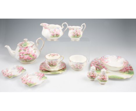 A selection of Royal Albert table ware in Blossom Time pattern comprising of; tea pot, milk jug, sugar bowl, cruet set, dinne