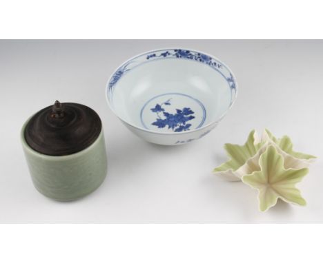 An early 20th Century Japanese blue and white porcelain bowl with floral decorated interior with bird and branch design exter