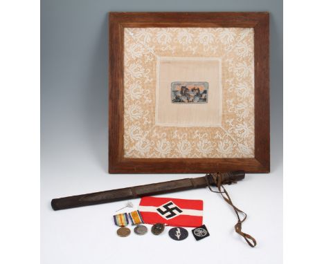 A lot to include an Asian / Oriental machete with wooden scabbard, German Nazi infantry wound badge, post war Nazi arm band, 