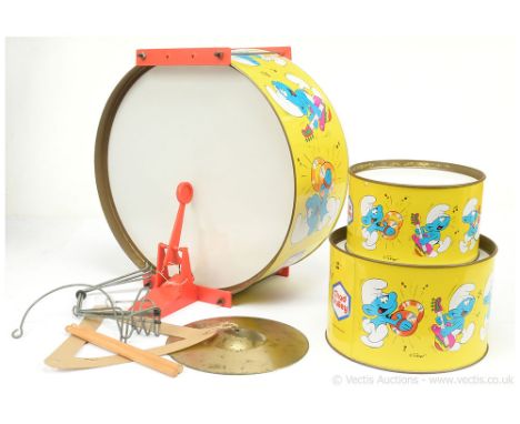 Chad Valley "The Smurfs" tinplate/plastic drum kit comprising of 3 x drums with sticks plus cymbal, comes complete with metal