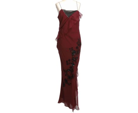 CHRISTIAN DIOR Abendkleid, Gr. 38. 100% Seide in Bordeaux mit apartem Ausschnitt, seitlichen Knopfverschluss und dekorativer 