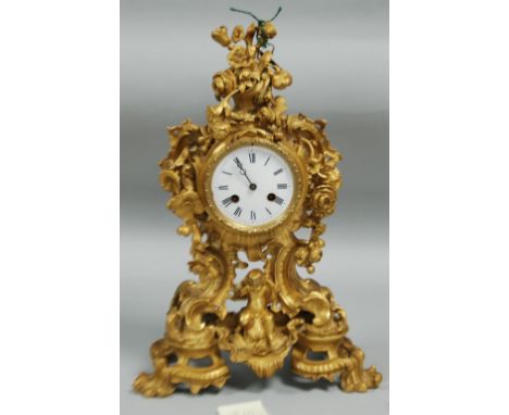 GOOD 19th CENTURY FRENCH ORMOLU CASED MANTEL CLOCK WITH WHITE ENAMEL DIAL AND ROMAN NUMERALS, without glass, the Rococo Reviv