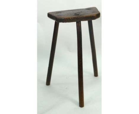 NINETEENTH CENTURY RUSTIC ELM TALL STOOL, the shaped oblong seat raised on three turned legs, 26" (66cm) high, 15 1/2" (39.4c