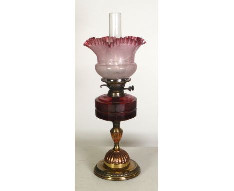 VICTORIAN CAST METAL TABLE OIL LAMP with ruby glass reservoir, etched and pink tinted, glass shade with wavy frilled border