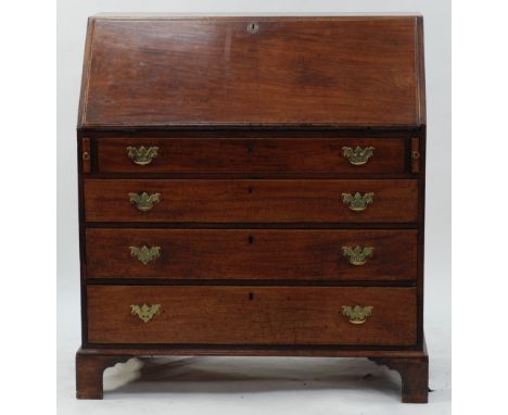 EARLY NINETEENTH CENTURY MAHOGANY BUREAU, of typical form, the sloping front outlined in boxwood and enclosing an interior wi