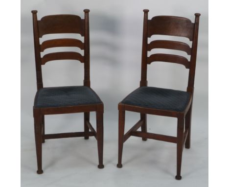 WILLIAM BIRCH, PAIR OF ARTS AND CRAFTS OAK LADDER BACK SINGLE DINING CHAIRS, each with ring turned uprights slightly bow fron