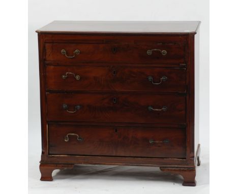 GEORGE III FLAME CUT MAHOGANY CHEST OF DRAWERS OF SMALL PROPORTIONS, the canted oblong crossbanded top above four long gradua