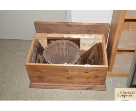 A pine trunk and contents to include various prints; a vintage wicker basket etc