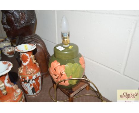 A Moorcroft 'Hibiscus' table lamp of ginger jar form and large size with a band of large flowers and leaves impressed marks