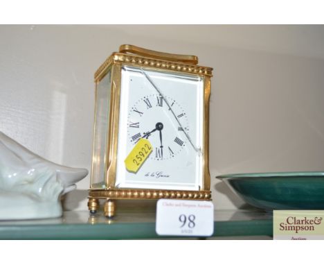 A brass cased carriage clock AF