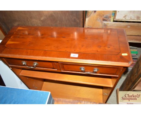 A yew wood effect bookcase fitted two drawers and shelf 