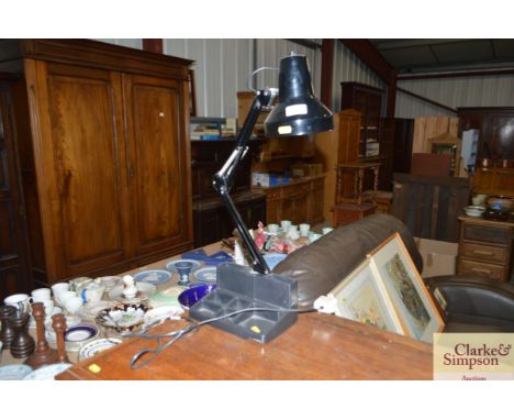 An angle poise type desk lamp and tidy