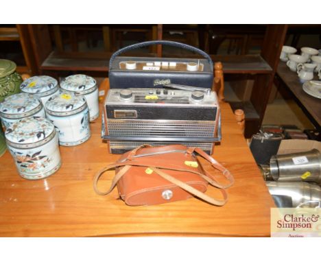 A Roberts vintage transistor radio; one other; and a camera