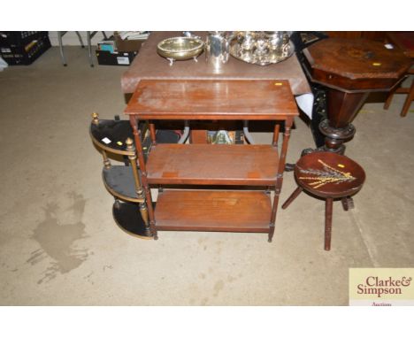 A mahogany three tier whatnot; and ebonised and gilt decorated corner shelf; and a painted three legged stool