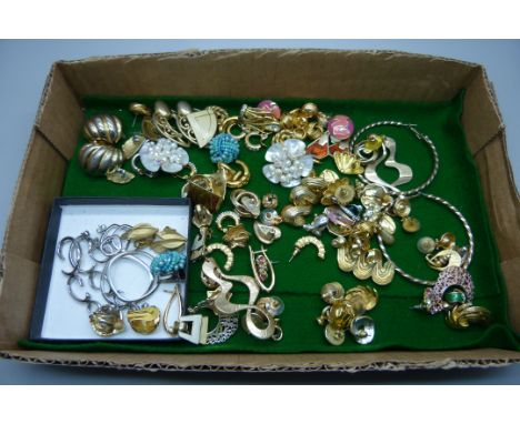 Approximately fifty pairs of costume earrings including Trifari and Fossil 