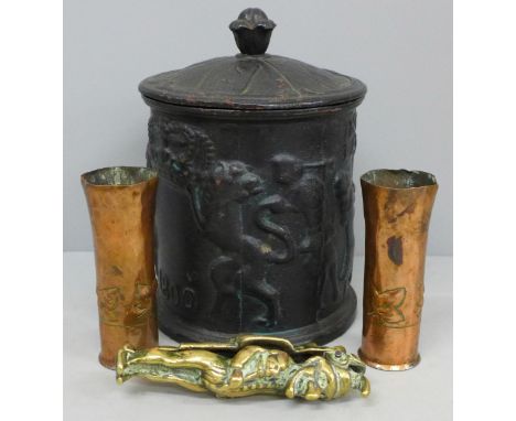 A cast iron tobacco jar, a Punch and Judy nutcracker and two pieces of trench art 