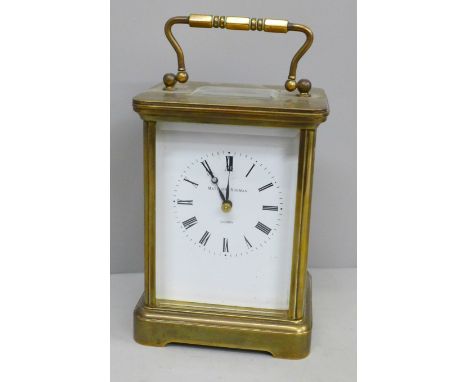 A Matthew Norman brass and four glass sided carriage clock with alarm and repeater 