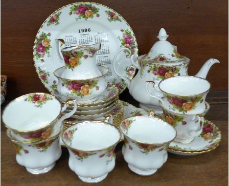 Royal Albert Old Country Roses tea ware; six cups, six saucers, six side plates, sugar, teapot, cake plate and a 1996 calenda