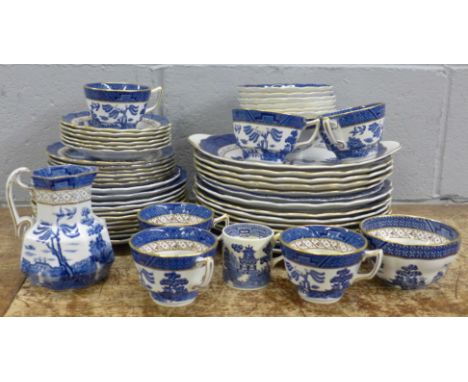 Thirteen Real Old Willow plates marked A8025 Booths; a serving plate, six cups and saucers, a milk jug, sugar bowl, etc. **PL