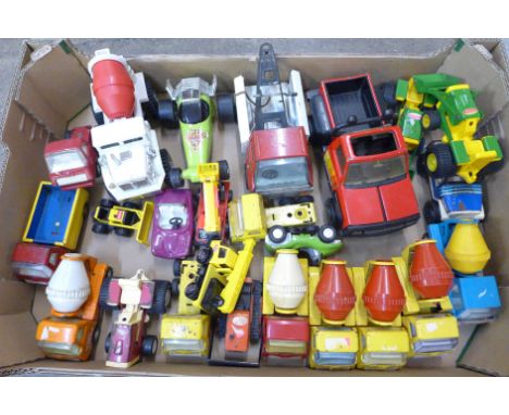 A collection of model vehicles, mainly Tonka, one Marx 