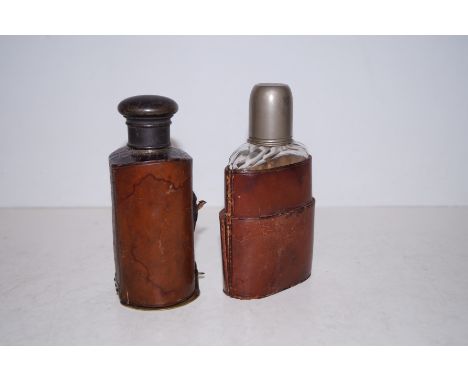 Two vintage leather bound flasks 