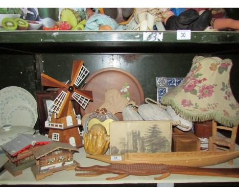 A shelf of miscellaneous wooden items