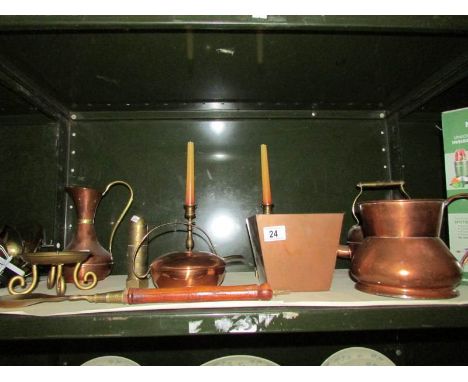 A shelf of assorted copper ware