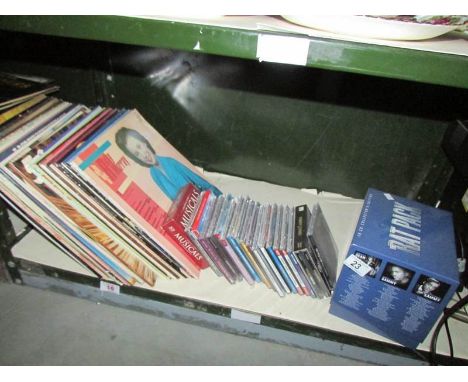 A shelf of LP records and CD's