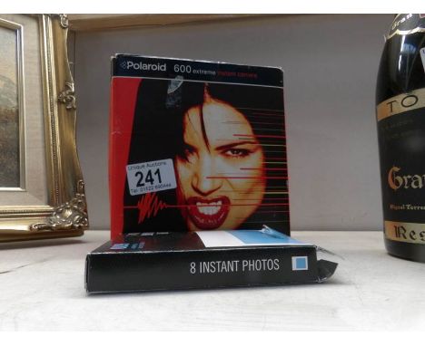 A boxed Polaroid 600 extreme instant camera with film
