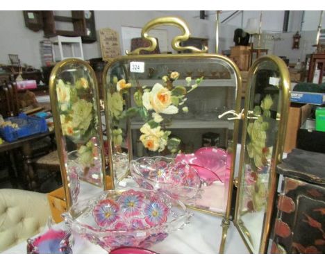 A triple brass and mirrored fire screen decorated with flowers