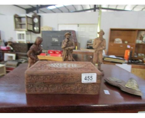 3 wooden figures, a wooden box and a Virgin Mary holy water font on wooden panel