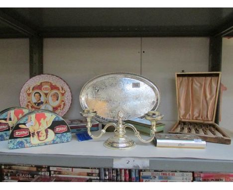 A shelf of tins, silver plate, cased cutlery etc