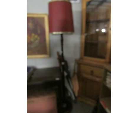 A standard lamp with shade