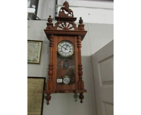 A mahogany wall clock