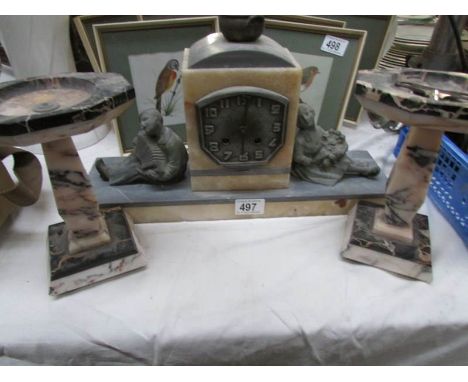 An French art deco mantel clock surmounted with boy and girl figure (springs ok)
