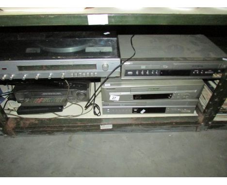 A shelf of Video recorders, record player etc