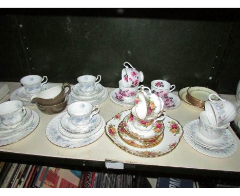 A shelf of assorted tea ware