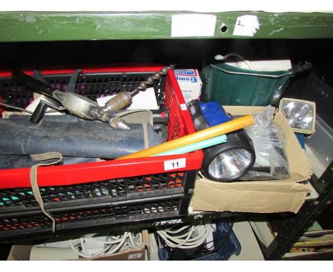 A shelf of assorted tools, torches etc