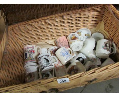 A wicker trunk containing commemorative mugs