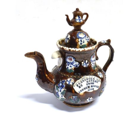 A MEASHAM BARGEWARE POTTERY TEAPOT  late 19th century, with typical treacle glazed and sprig moulded decoration, impressed 'P